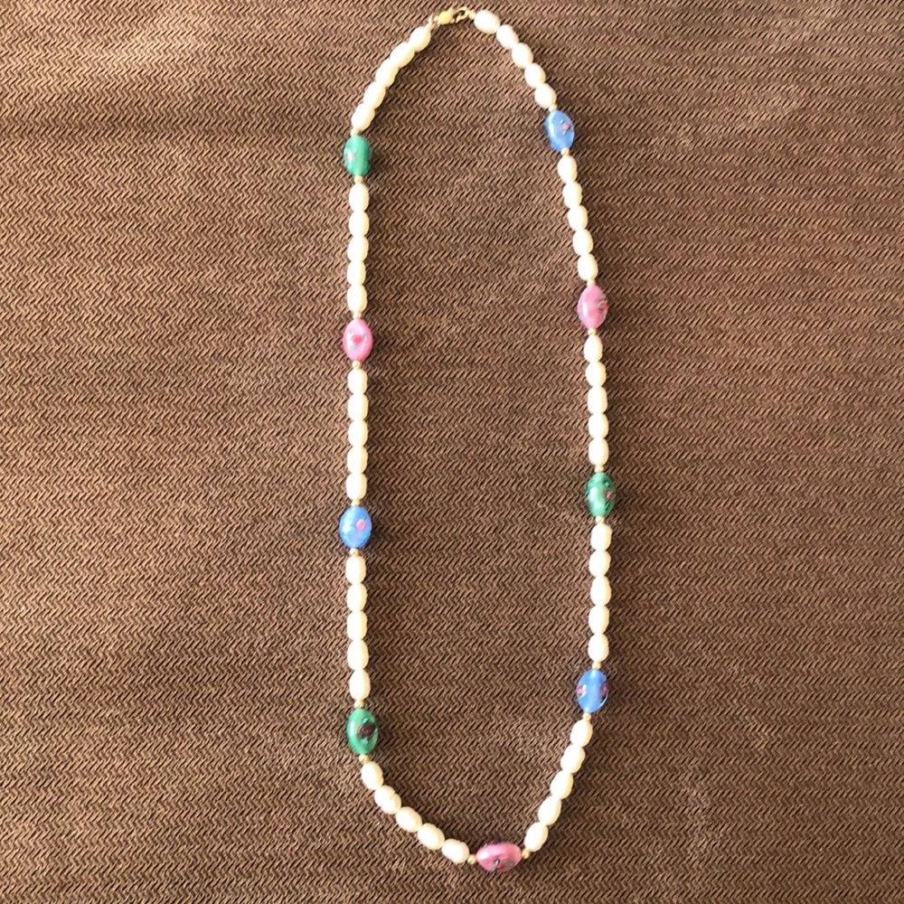 Fresh water oval pearl beads with glass and gold tone beads, 21 1/2 “ long.